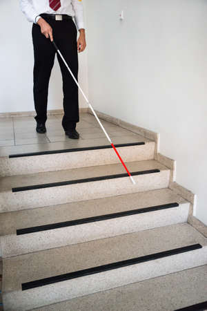 Blind Man Moving Down On Stairway Holding Stick Stok Foto�raf - 35462481
