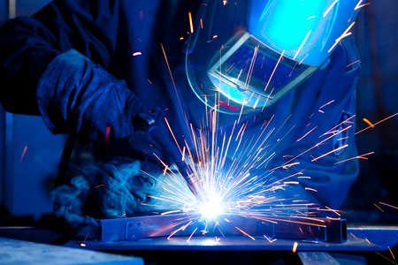 Welder erecting technical steel. Industrial steel welder in factory technical - 84131573