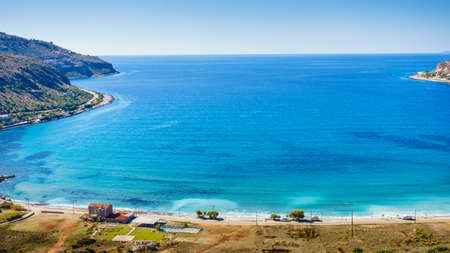 Southern greece mani peninsula. sea landscape rocky coastline and camper cars mobile home on beach, peloponnese.