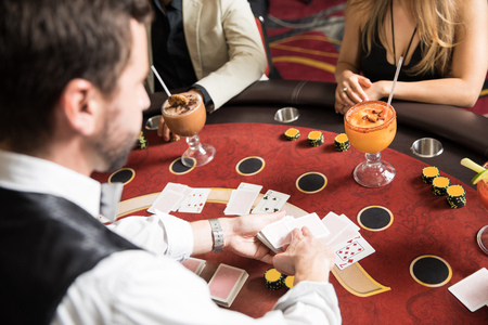 Point of view of a card dealer at work in a blackjack table in a casino - 92217065