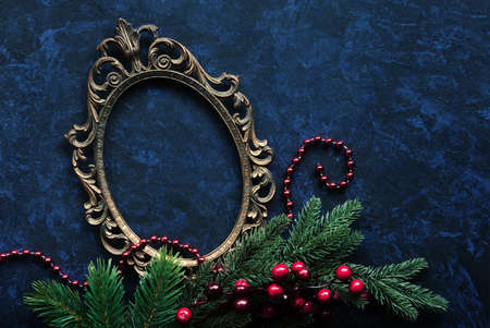stock photo vintage metal oval frame on a dark background with christmas decoration - Metal Frame Christmas Decorations stock photo vintage metal oval frame on a dark background with christmas decoration - Metal Frame Christmas Decorations