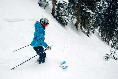 girl with special ski equipment is riding fast jumping freeriding