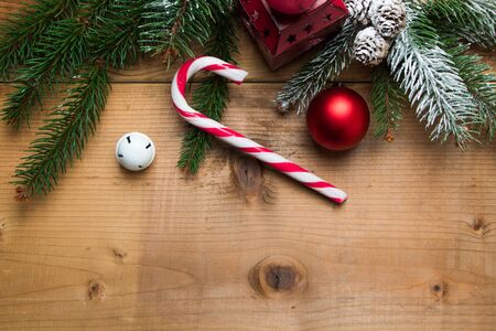 rustic christmas background with fir candy cane and ornaments on a table stock photo - Rustic Christmas Background rustic christmas background with fir candy cane and ornaments on a table stock photo - Rustic Christmas Background