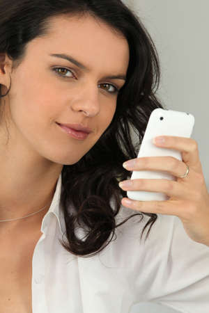 Brunette woman looking mobile