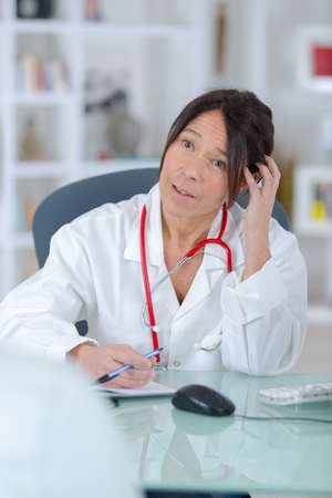 female doctor listening to her patient
