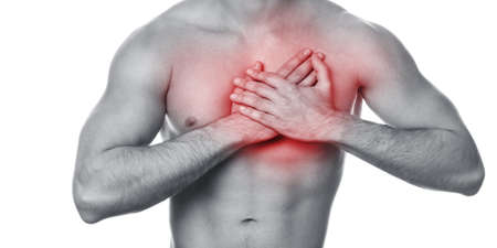 白い背景の上の彼の胸の痛みと若い男 の写真素材 画像素材 Image