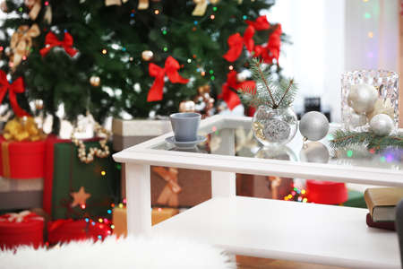 cup and glass vases with christmas decor on white table in living room decorated for christmas - How To Decorate Glass Vases For Christmas cup and glass vases with christmas decor on white table in living room decorated for christmas - How To Decorate Glass Vases For Christmas
