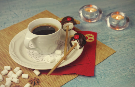 Christmas decoration of breakfast table with coffee cup and handmade marshmallow candies deers