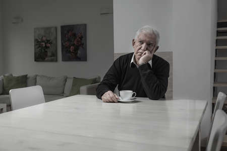 sad lonely: Senior sad lonely man and his coffee time Stock Photo