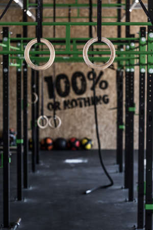 Photo of crossfit zone with gymnastic circles on gym Stock Photo