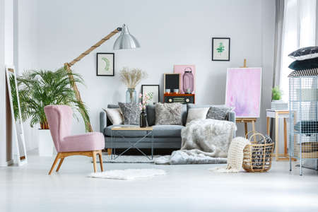 cozy living room with pink accents fur blanket and decorative