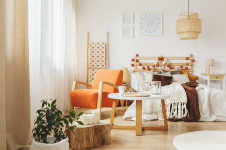 Cozy Bedroom Interior With Comfortable Looking Chair Facing The