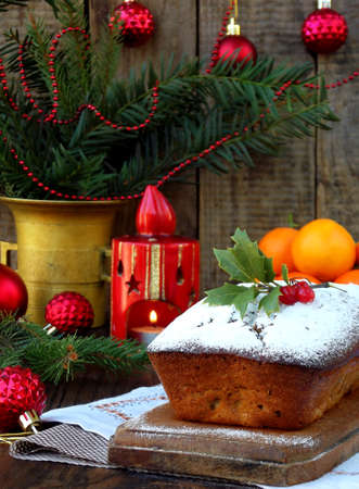 stock photo traditional christmas fruit cake decorated with powdered sugar and xmas decorations candle copy space style rustic - Christmas Fruit Cake Decoration stock photo traditional christmas fruit cake decorated with powdered sugar and xmas decorations candle copy space style rustic - Christmas Fruit Cake Decoration