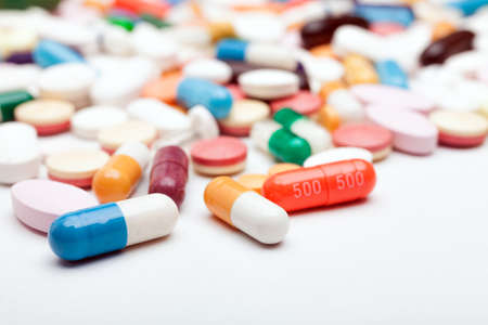 Pills and capsules on white background Stock Photo