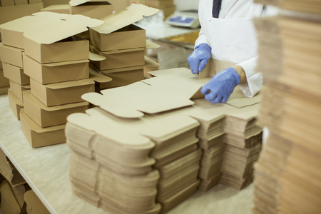 Person at work in a cookies factory - 116467029