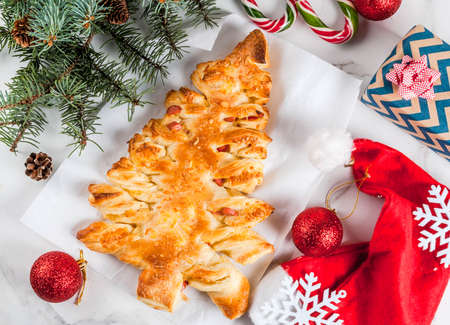 snacks for christmas party closed pizza from puff pastry in the form of a christmas - Christmas Eve Snacks snacks for christmas party closed pizza from puff pastry in the form of a christmas - Christmas Eve Snacks