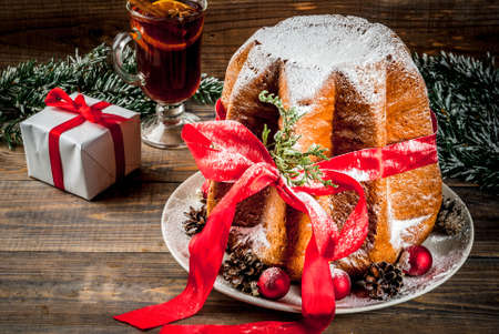 stock photo traditional italian christmas fruit cake panettone pandoro with festive red ribbon and christmas decorations gift box and mulled wine - Italian Christmas stock photo traditional italian christmas fruit cake panettone pandoro with festive red ribbon and christmas decorations gift box and mulled wine - Italian Christmas