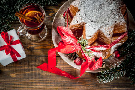 stock photo traditional italian christmas fruit cake panettone pandoro with festive red ribbon and christmas decorations gift box and mulled wine - Italian Christmas stock photo traditional italian christmas fruit cake panettone pandoro with festive red ribbon and christmas decorations gift box and mulled wine - Italian Christmas
