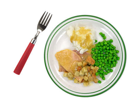 Eine Gekochte Puten In Sosse Mit Croutons Kartoffelpuree Und Grune Erbsen Auf Einem Teller Mit Roter Behandelt Gabel Zur Seite Lizenzfreie Fotos Bilder Und Stock Fotografie Image 32009928