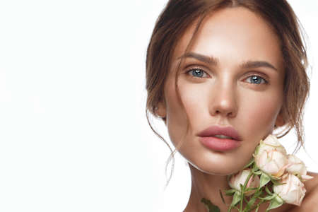 Beautiful Woman With Classic Make-up, Light Hairstyle And Flowers. Beauty Face. Photo Taken In Studio