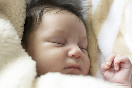 litlte newborn girl you can see in detail his right hand and