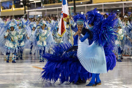 Rio, brazil - february 21, 2020: 1st master of ceremonies and flag bearer couple jefferson gomes e paulinha penteado of the samba school vigario geral, during the first day of the access group parade at the carnival in de janeiro, held at the marques