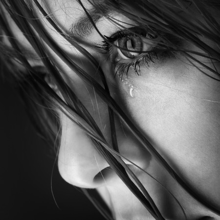 sad lonely: beauty girl cry on black background