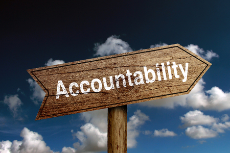 wooden road sign with text accountability against blue cloudy