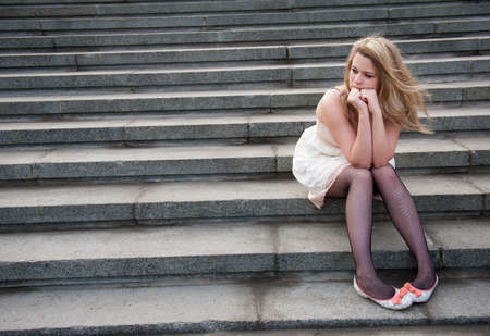 sad lonely: Sad lonely girl sitting on the steps