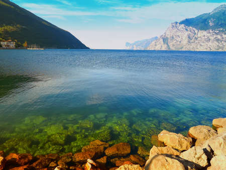 Lake garda seen from the shore of torbole, trentino, italy