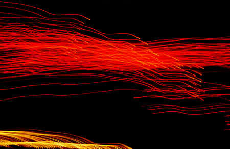 블랙에 추상 오렌지와 노란색 빛 줄무늬 스톡 콘텐츠