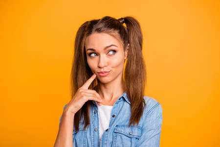 Beautiful pretty woman thinking gesture over yellow background