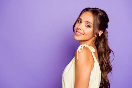 Close-up profile side view portrait of her she nice-looking attractive lovable fascinating magnificent winsome cheerful wavy-haired girl isolated over violet pastel background Banco de Imagens