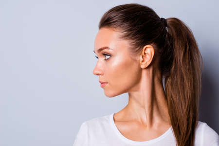 Close up side profile view photo amazing beautiful she her lady perfect appearance look side empty space not smiling reliable person wear casual white t-shirt clothes isolated grey background Banco de Imagens