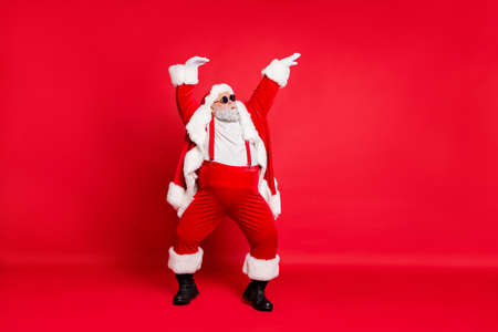 Feeling young and fresh concept. full length photo of comic humorous joking carefree careless enjoying bass sound music moving hands in air wearing coat isolated vivid background Stock Photo