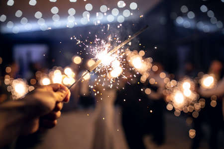 Sparkler burns in hand.happy new year 2022