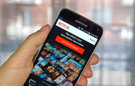 logo samsung: MONTREAL, CANADA - MARCH 20, 2016 - Netflix application running Samsung S5. Netflix is a popular global provider of streaming movies and TV series