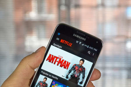 logo samsung: MONTREAL, CANADA - MARCH 20, 2016 - Netflix application running Samsung S5. Netflix is a popular global provider of streaming movies and TV series