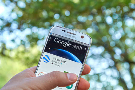 logo samsung: MONTREAL, CANADA - MAY 23, 2016 : Google Earth application on Samsung S7 screen. Google Earth is a virtual globe, map and geographical information program that was originally called EarthViewer 3D.