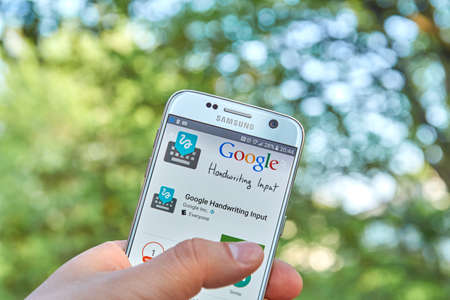 logo samsung: MONTREAL, CANADA - MAY 23, 2016 : Google Handwriting application on Samsung S7 screen. Google Handwriting Input allows users to handwrite text on a phone or tablet in 87 languages.