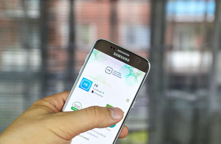 logo samsung: MONTREAL, CANADA - JUNE 24, 2016 : Facebook F8 app on Samsung S7 screen. Facebook F8 is an annual developer conference showcases Facebooks latest products and a look at whats next. biên tập