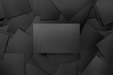 blank black business card above pile of black business cards stock business card background black