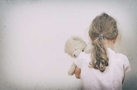 sad lonely: Little girl crying in the corner Domestic violence concept Stock Photo