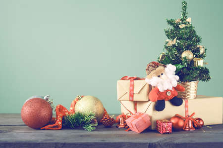 Festive Christmas Tree Stands On Dark Boards. Christmas Background #92201766 - Festive Christmas tree stands on dark boards. Christmas background. Christmas decorations on a green background. Space for text. - Festive Christmas Tree Stands On Dark Boards. Christmas Background