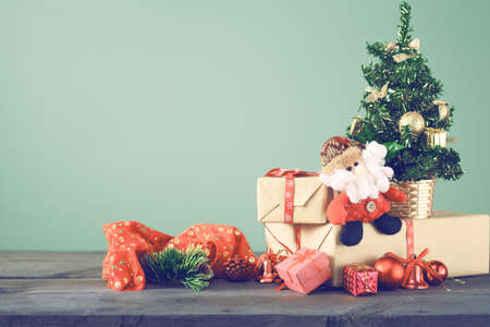 Festive Christmas Tree Stands On Dark Boards. Christmas Background Festive Christmas tree stands on dark boards. Christmas background. Christmas decorations on a green - Festive Christmas Tree Stands On Dark Boards. Christmas Background