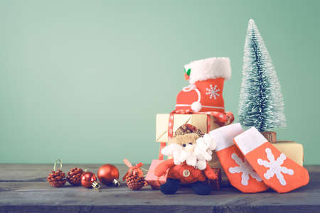 Festive Christmas Tree Stands On Dark Boards. Christmas Background Festive Christmas tree stands on dark boards. Christmas background. Christmas decorations on a green - Festive Christmas Tree Stands On Dark Boards. Christmas Background