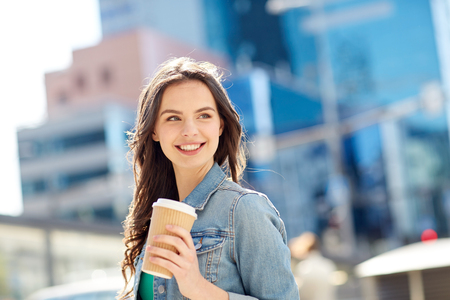 Drinks And People Concept Happy Young Woman Or Teenage Girl Drinking Coffee From Paper Cup Drinks And People Concept Happy Young Woman Or Teenage Girl Drinking Coffee From Paper Cup
