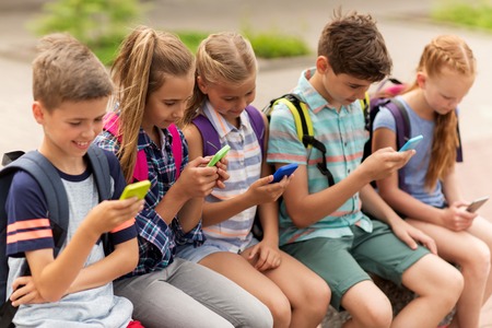 Image result for images of students addicted to the use of mobile telephone