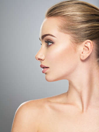 Profile face of  young  woman, skin care treatment. Side view of beautiful girl with healthy skin of the face - 88948565