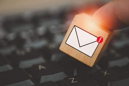 Man touching cube block with envelope and notifications symbol icon for the new e mail message inbox the concept of computer browsing communication
